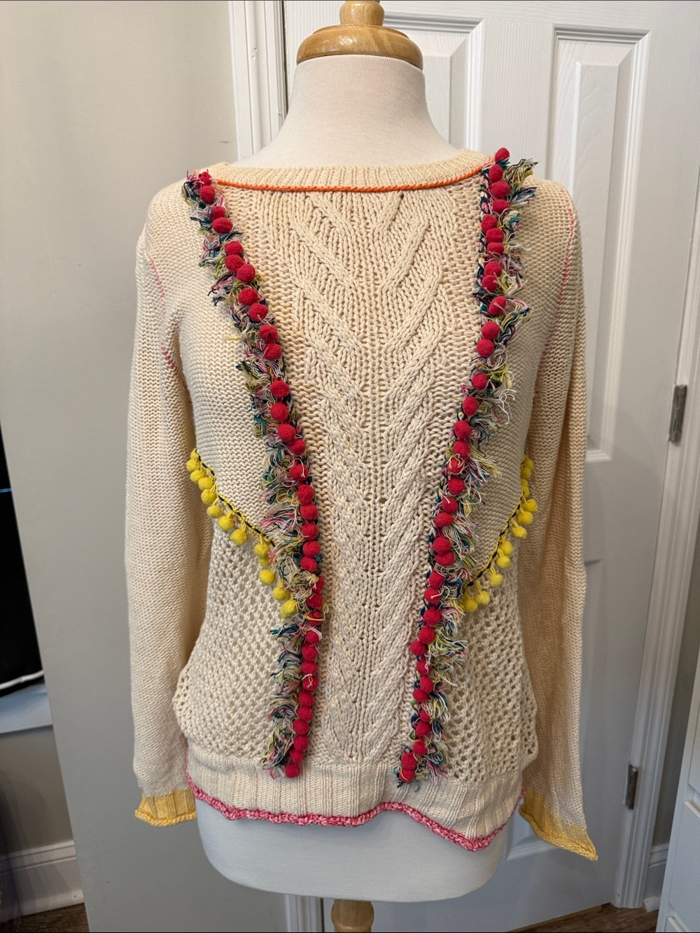 Angel Of The North Cream Cable Sweater with Red and Yellow Pom Trim